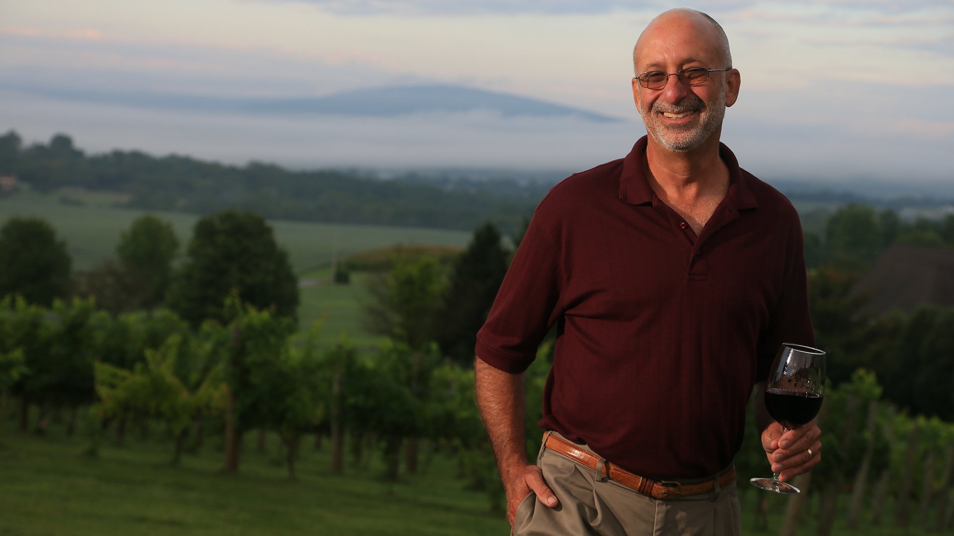 Winery owner Garry Cohen standing on the wineyard 